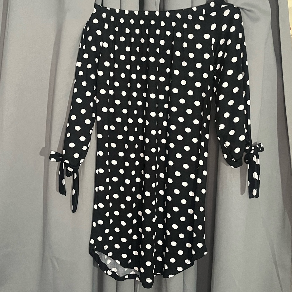 Large black dress with white polkadots.